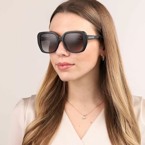 Woman wearing stylish black sunglasses